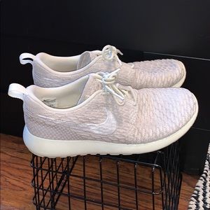 cream and white nike running shoes